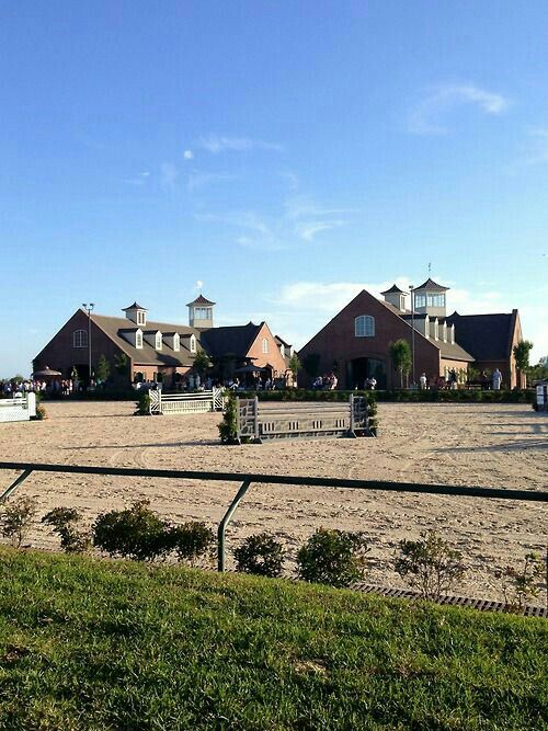The Stables at Le Bocage - barns and riding arenas at golden hour